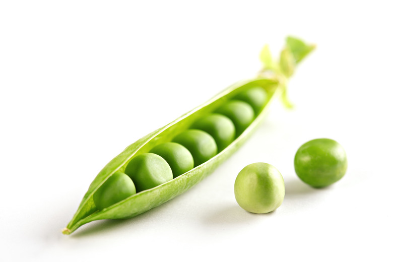 Close-Up Of Green Peas On White Background