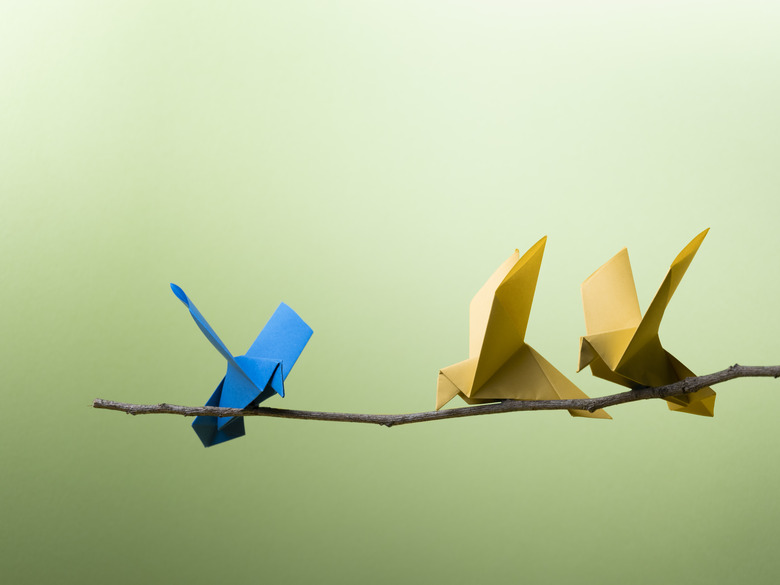 Conceptual Nature - 3 Origami Birds Sitting On A branch.