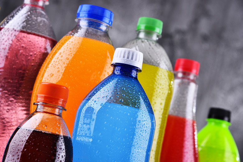 Plastic bottles of assorted carbonated soft drinks