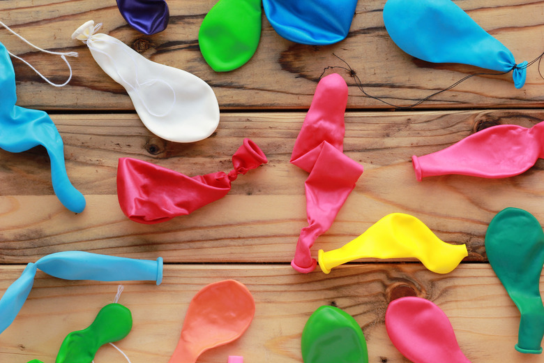 Flat lay of scattered colorful unblown balloons