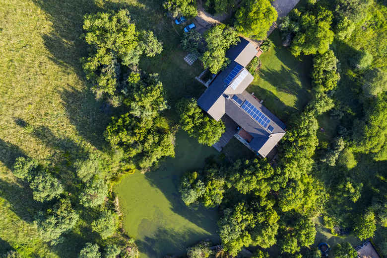 Aerial view of solar panels on a rooftop of a residential home