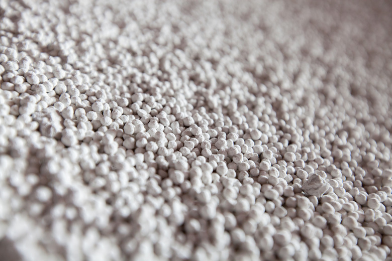 White granules (pellets) of phosphoric fertilizers on fertilizers factory. Chemical plant. Close-up.