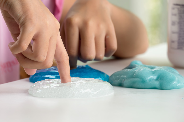 Kid Playing Hand Made Toy Called Slime