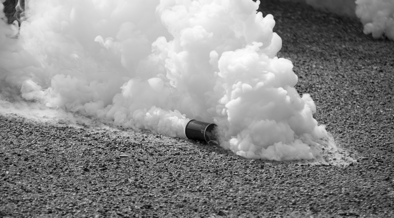 Tear gas in motion in black and white 