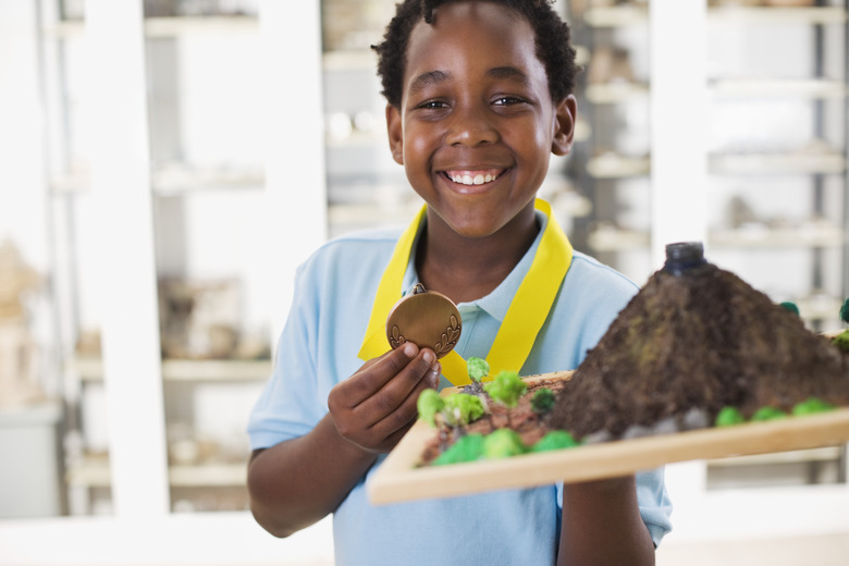 Boy Holding Science Fair Project