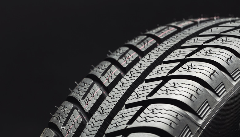 Close-Up Of Tire Against Black Background