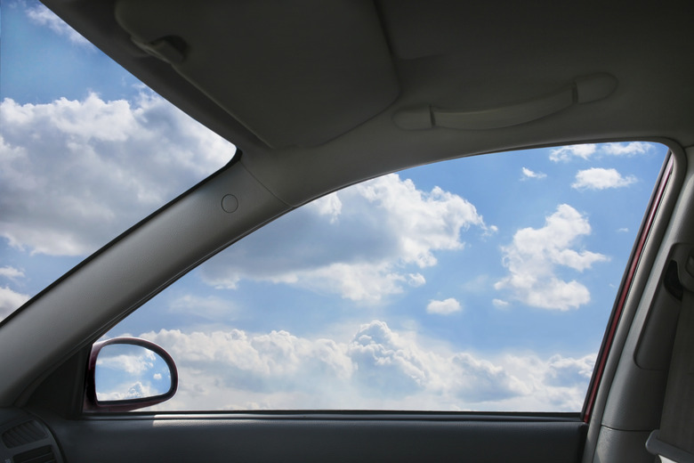 landscape behind  car window