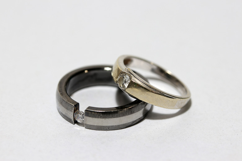 Two diamond rings stacked on white background.