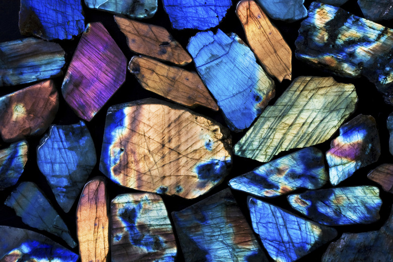 Background picture of many colorful labradorite gems.