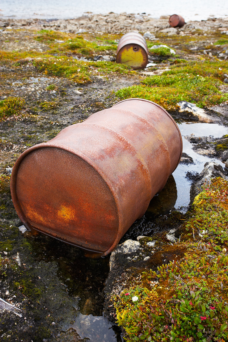 Rusting barrels polluting Arctic tundra