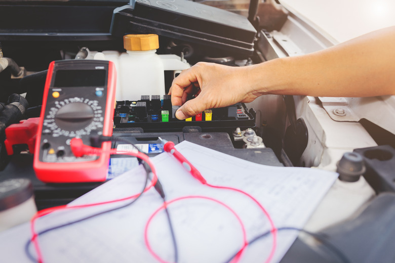 Multimeter to check the fuse in a car.