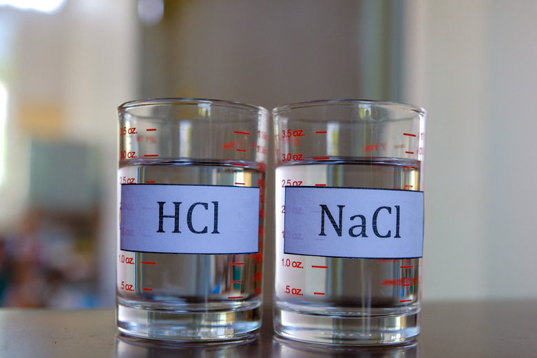 Sodium chloride and hydrochloric acid solution in glass