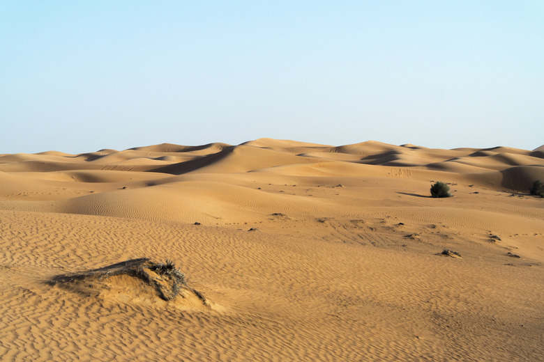 Arabian desert dune background on blue sky