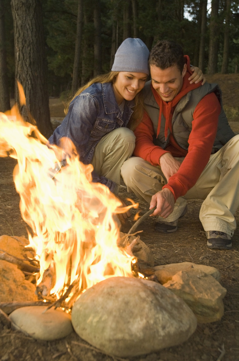 Couple by campfire