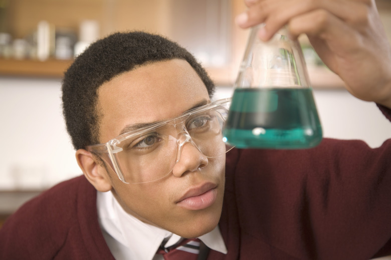 Student watching chemistry experiment