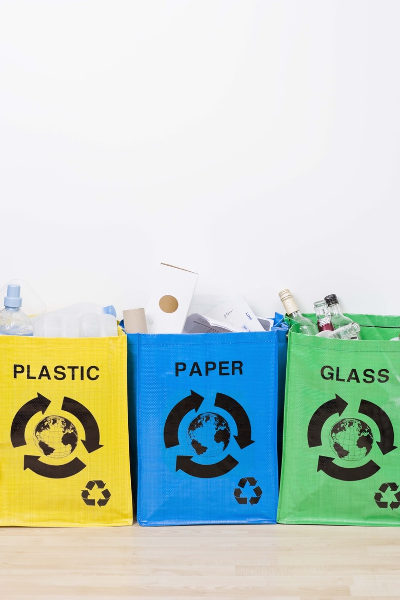 Plastic, paper, and glass recycling bins