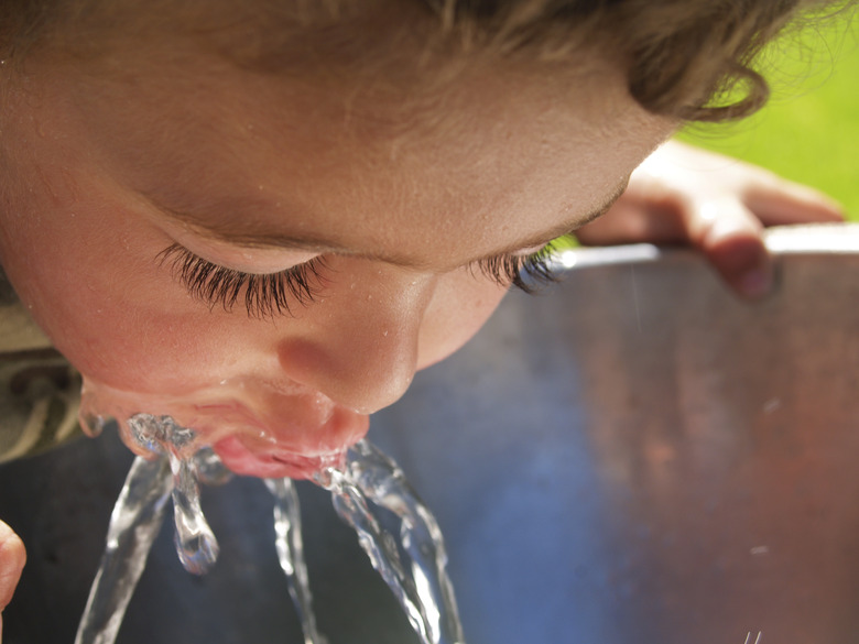 Young boy at drinking fountain