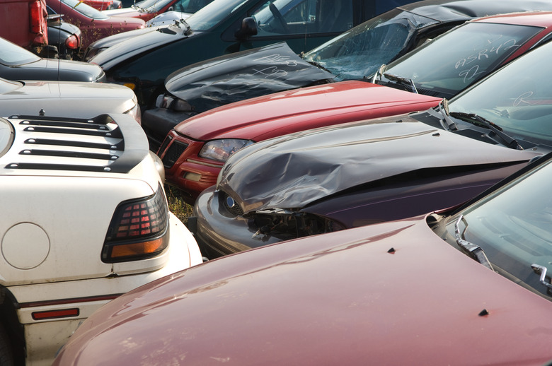 Wrecked cars in junkyard