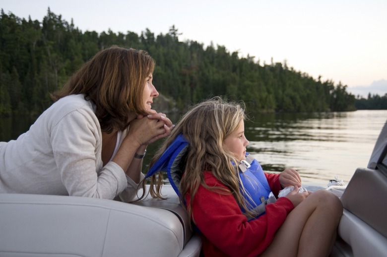 Mother and daughter boating, Lake of the Woods, Ontario, Canada