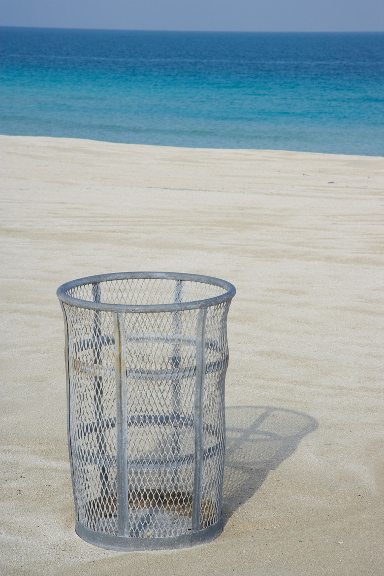 Empty trash basket on beach in Miami, Florida