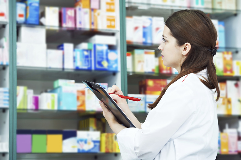 Pharmacy chemist woman in drugstore