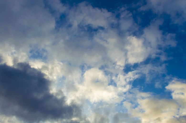 Clouds gray on a blue sky and white clouds.