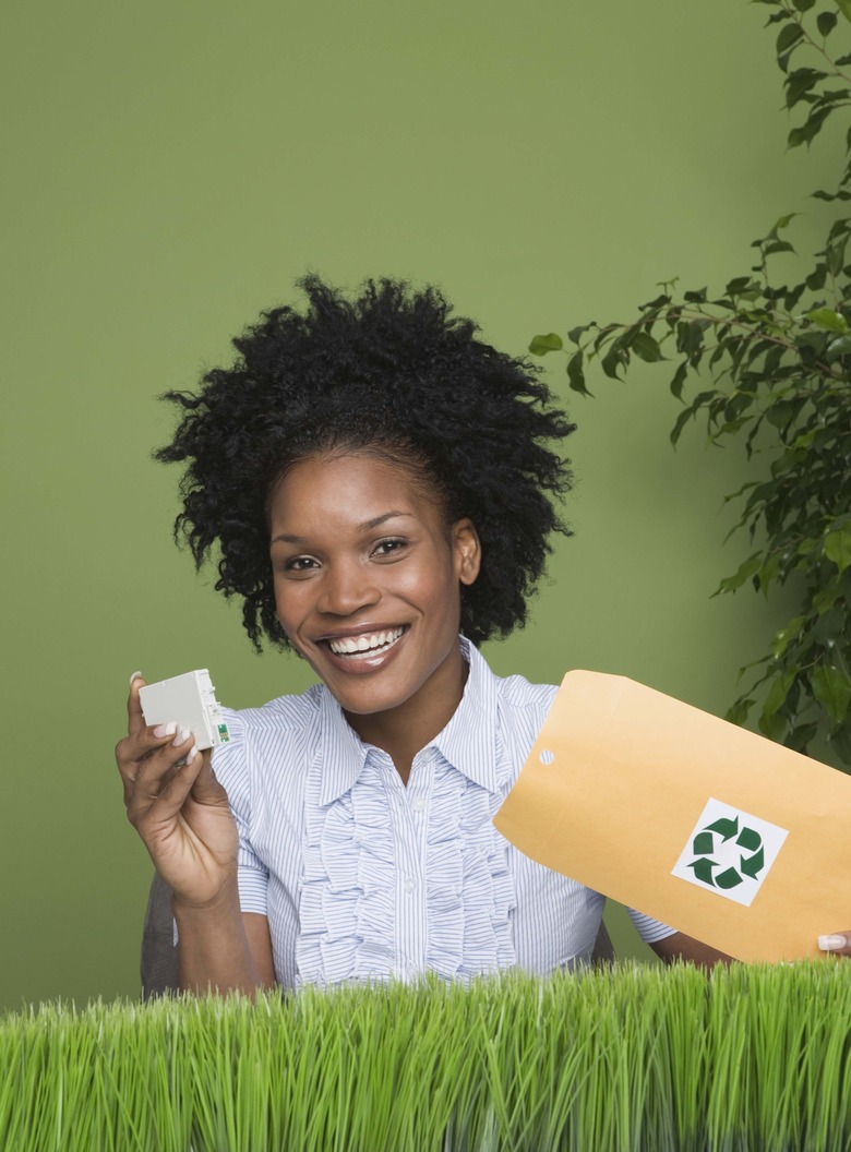 Woman holding recycling ink cartridge