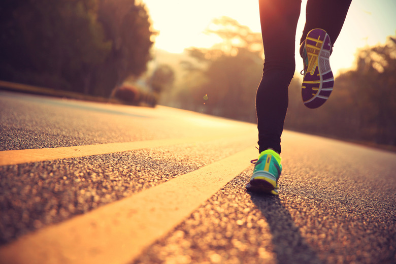 young fitness woman runner athlete running at road