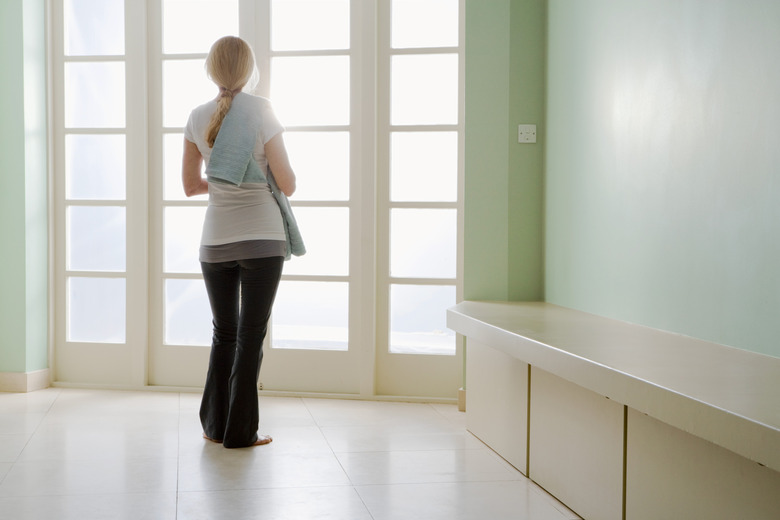 Woman in casual attire holding towel