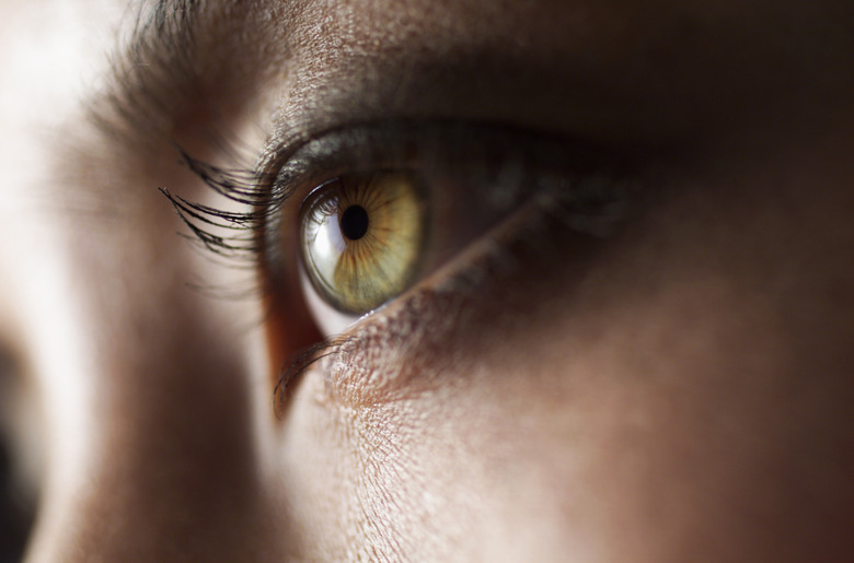 a close up shot of a beautiful green eye