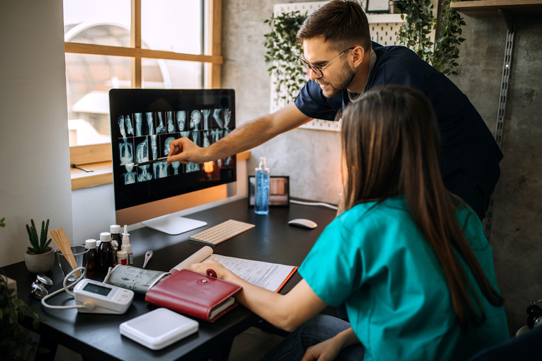 Doctors examining x-ray in home office enviroemt