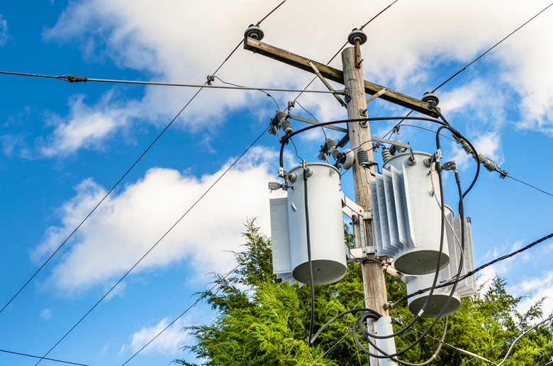 Electricity Pole with Transformers and Blue Sky