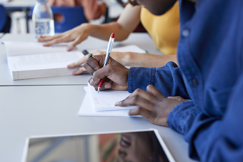 A group of people studying or taking a test