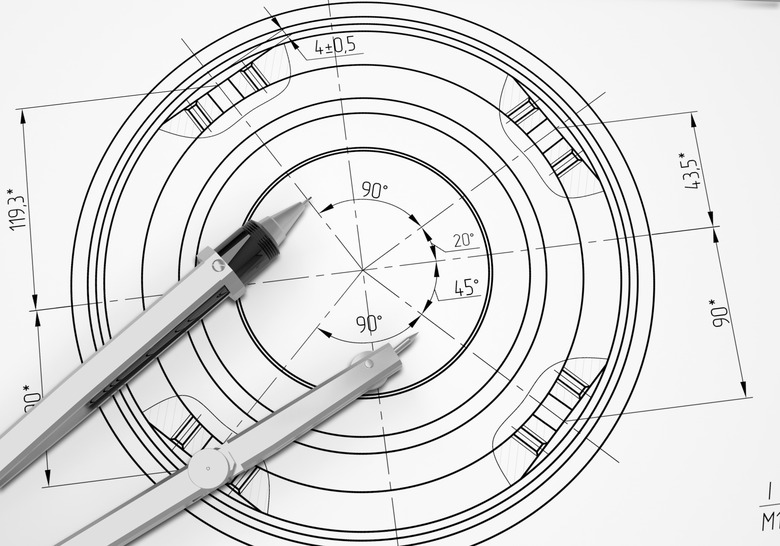 Compass lie on the drawing