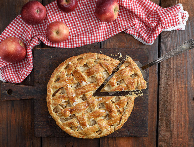 baked traditional fruit cake on a brown wooden board