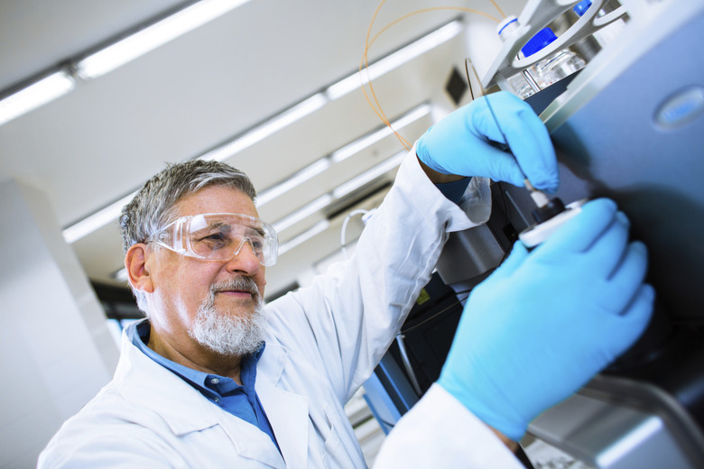 Senior male researcher carrying out scientific research in a lab