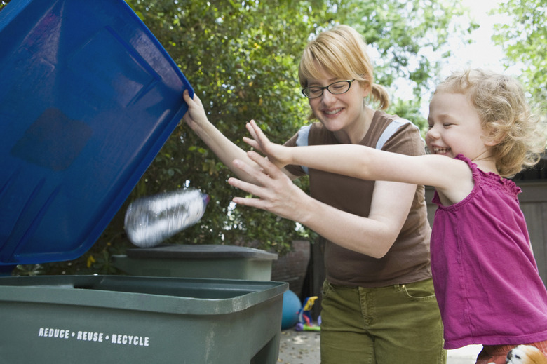 Mother and daughter recycling