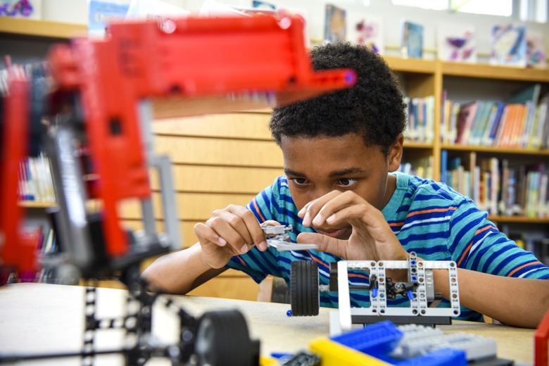 Child building a robot