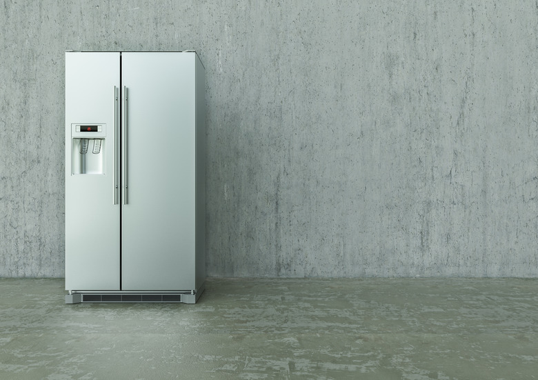 Solar Refrigerator on a concrete wall and floor