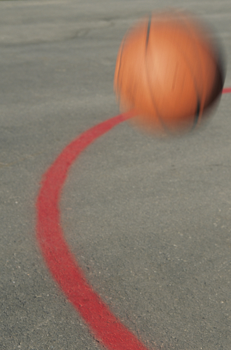 View of basketball bouncing on court