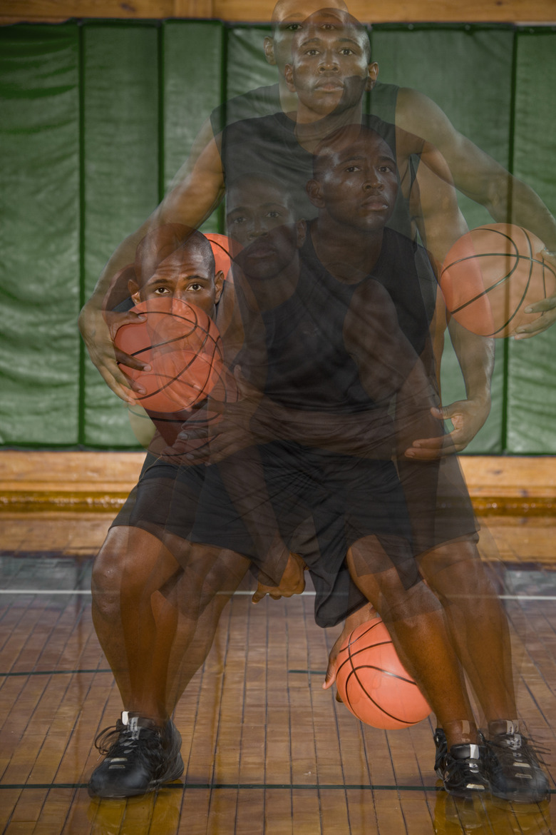 Basketball player dribbling ball on court (Digital Composite)