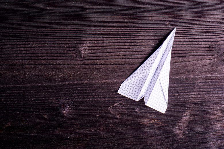 Wooden board background, textured plank, paper airplane, copy sp