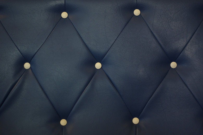 white bottoned on blue leather pattern background