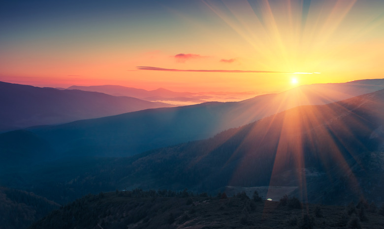 Panoramic view of  colorful sunrise in mountains.