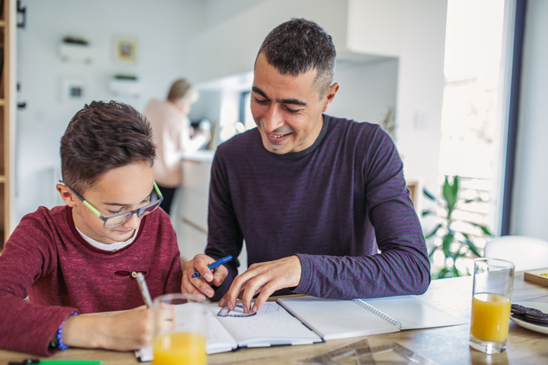 Dad helps son with math