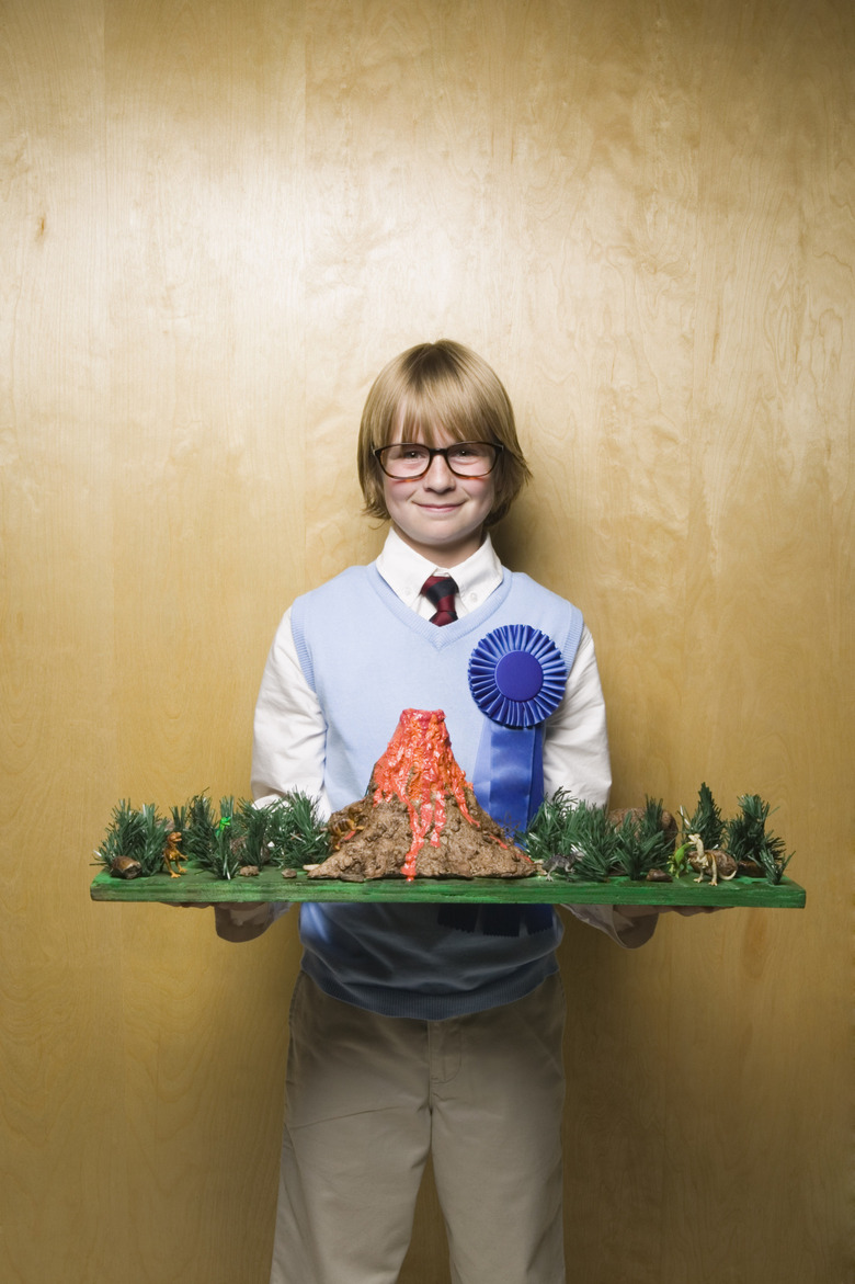 Boy with prize winning model volcano