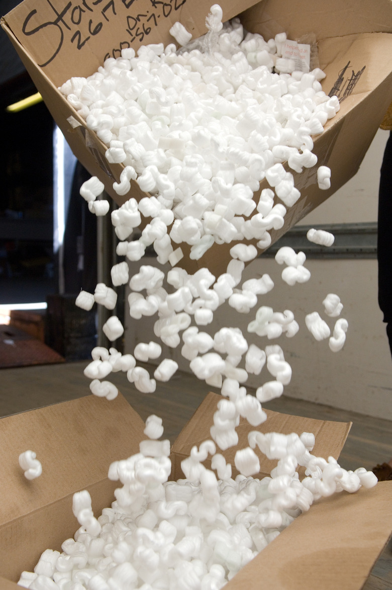 Pouring packing peanuts from one box to another