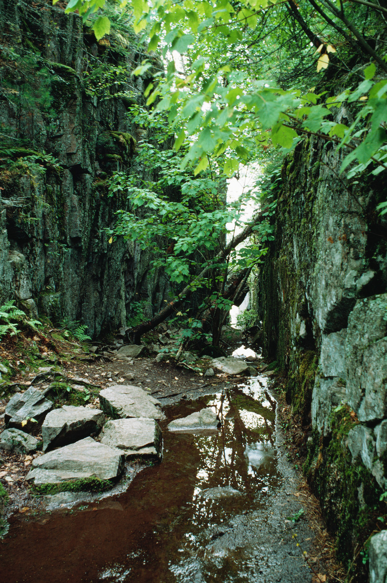 Muddy stream through rock walls, Lake Superior, Ontario, Canada