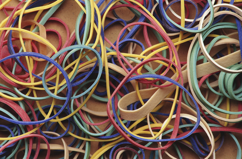 Colorful elastic bands on white background