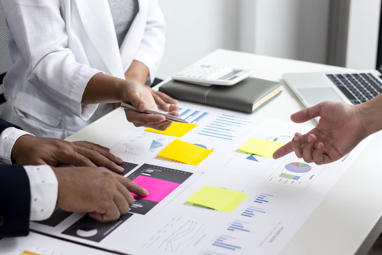 Company performance meeting led by a woman manager, business management concept.